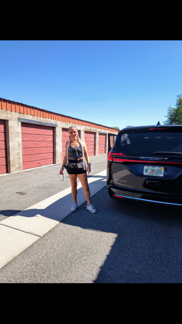 A customer with her car at Linden Mini Storage